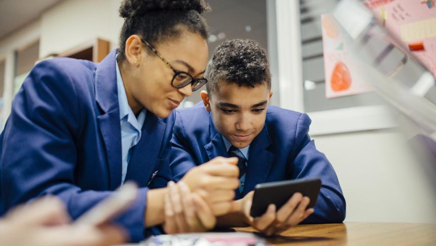Two students watching mobile phone