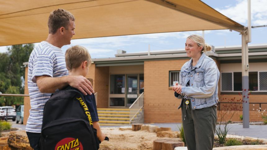 Teacher talking to parent and student
