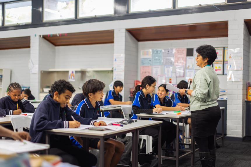 Teacher standing at the front of the class